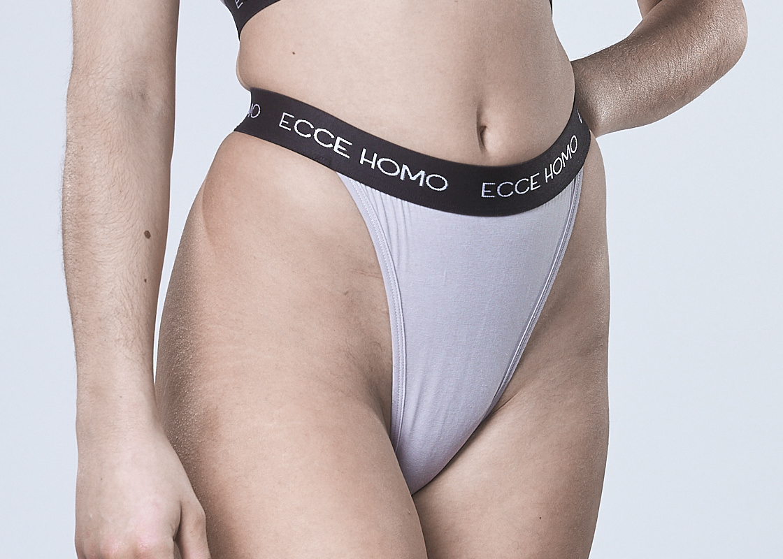 all genders inclusive grey thong with black logo band.